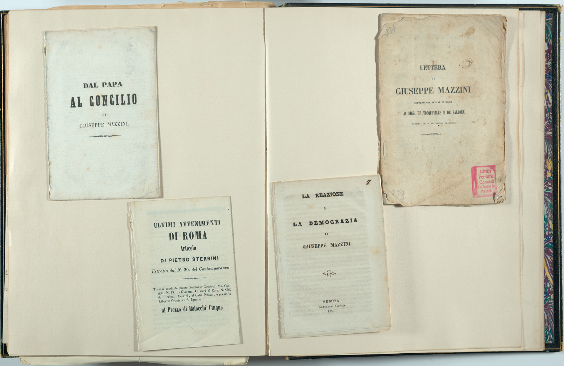 Four pamphlets mounted on two scrapbook pages